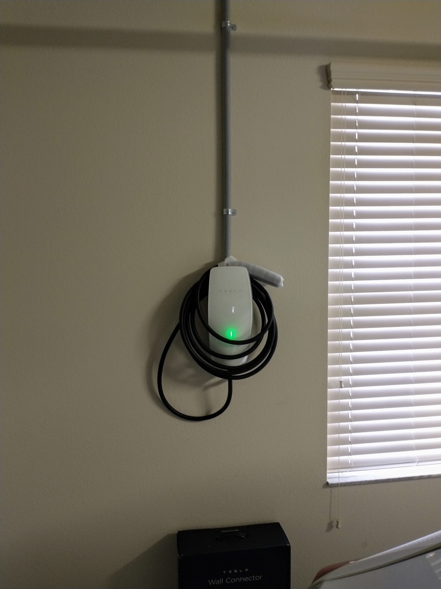 Hardwired EV charger installed in a home garage